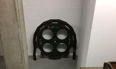 Toothed cog wheel that once made up part of the conveyor