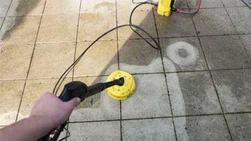 Photo of a pavement being jetwashed